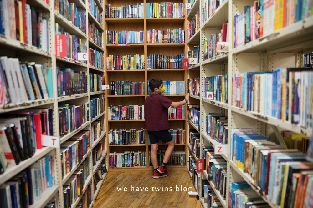 child browsing the strand bookstore new york city